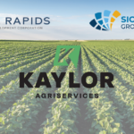 soybean field with Kaylor AgriServices logo, Dell Rapids Economic Development Logo and SMGA logo